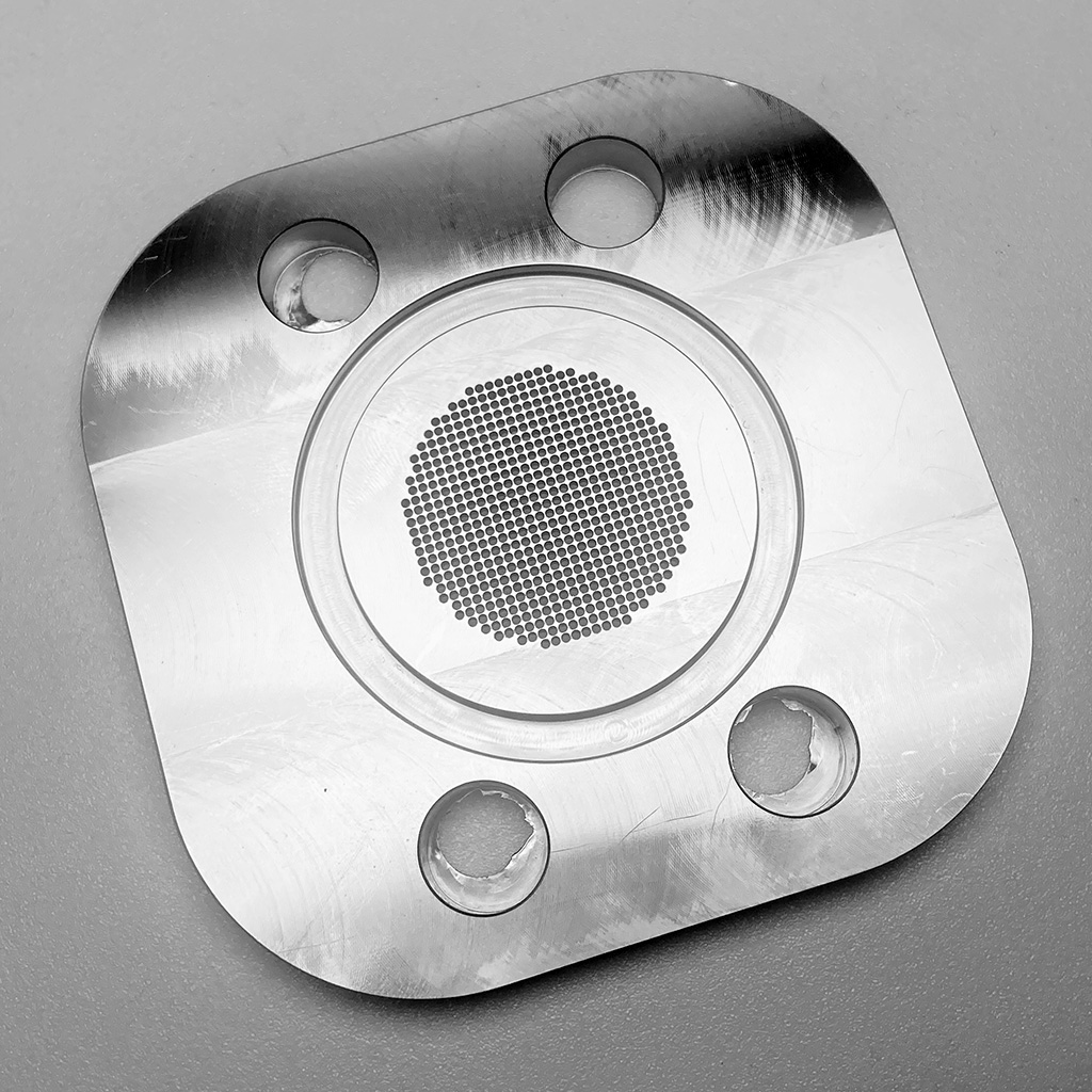 CNC precision drilling of dense hole patterns in stainless steel extrusion plates